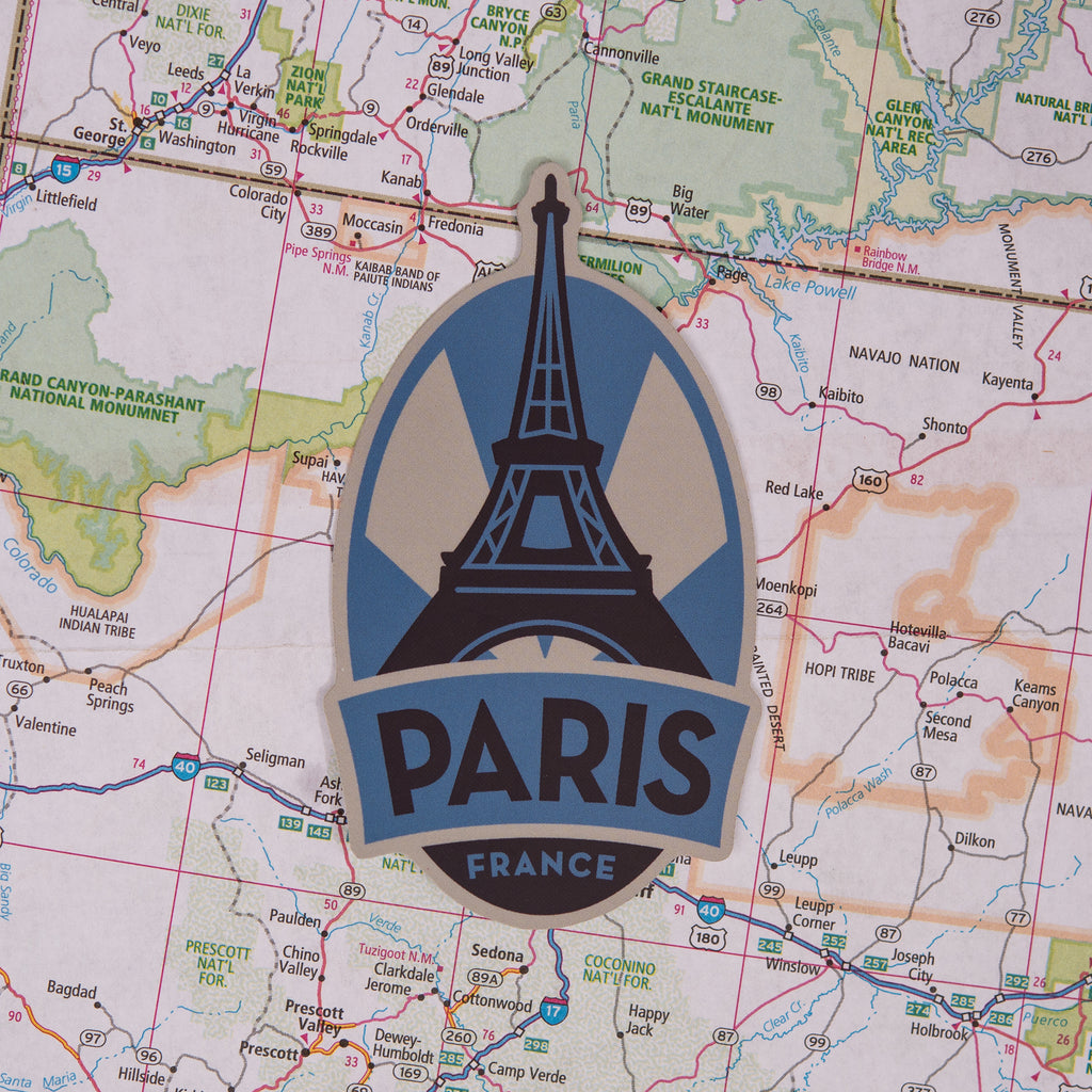 Paris sticker on a map background