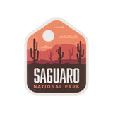 Saguaro National Park sticker featuring cacti and mountains in warm sunset colors.