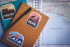 travel stickers on notebooks