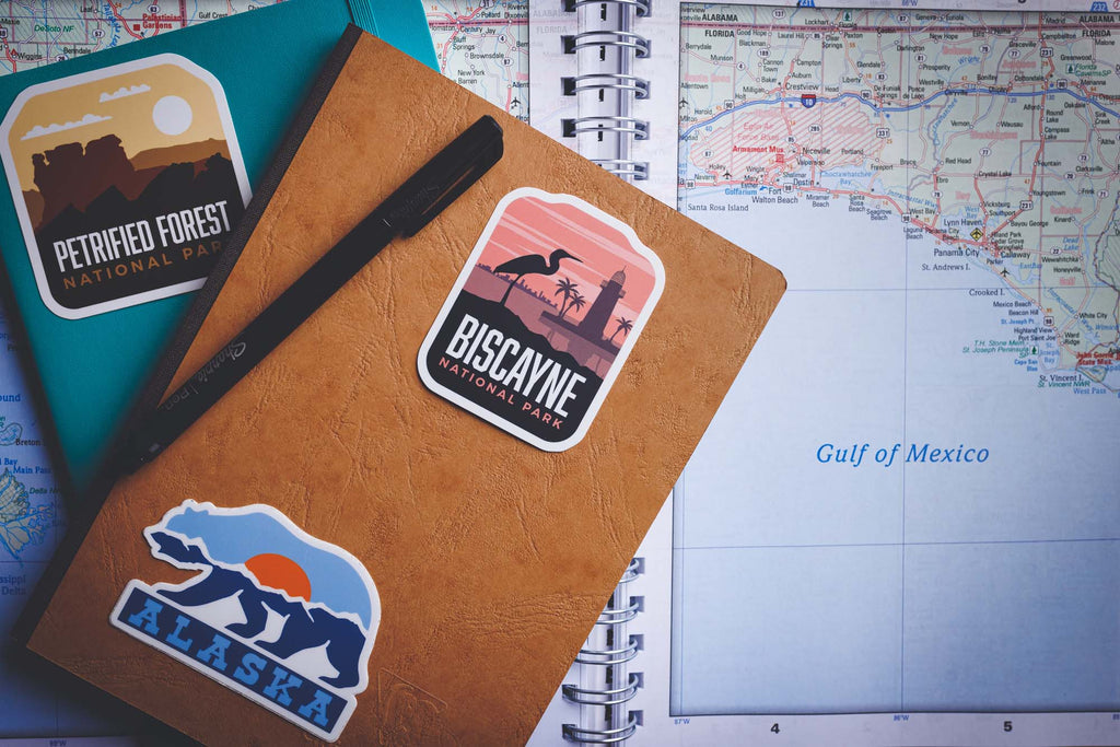 travel stickers on notebooks